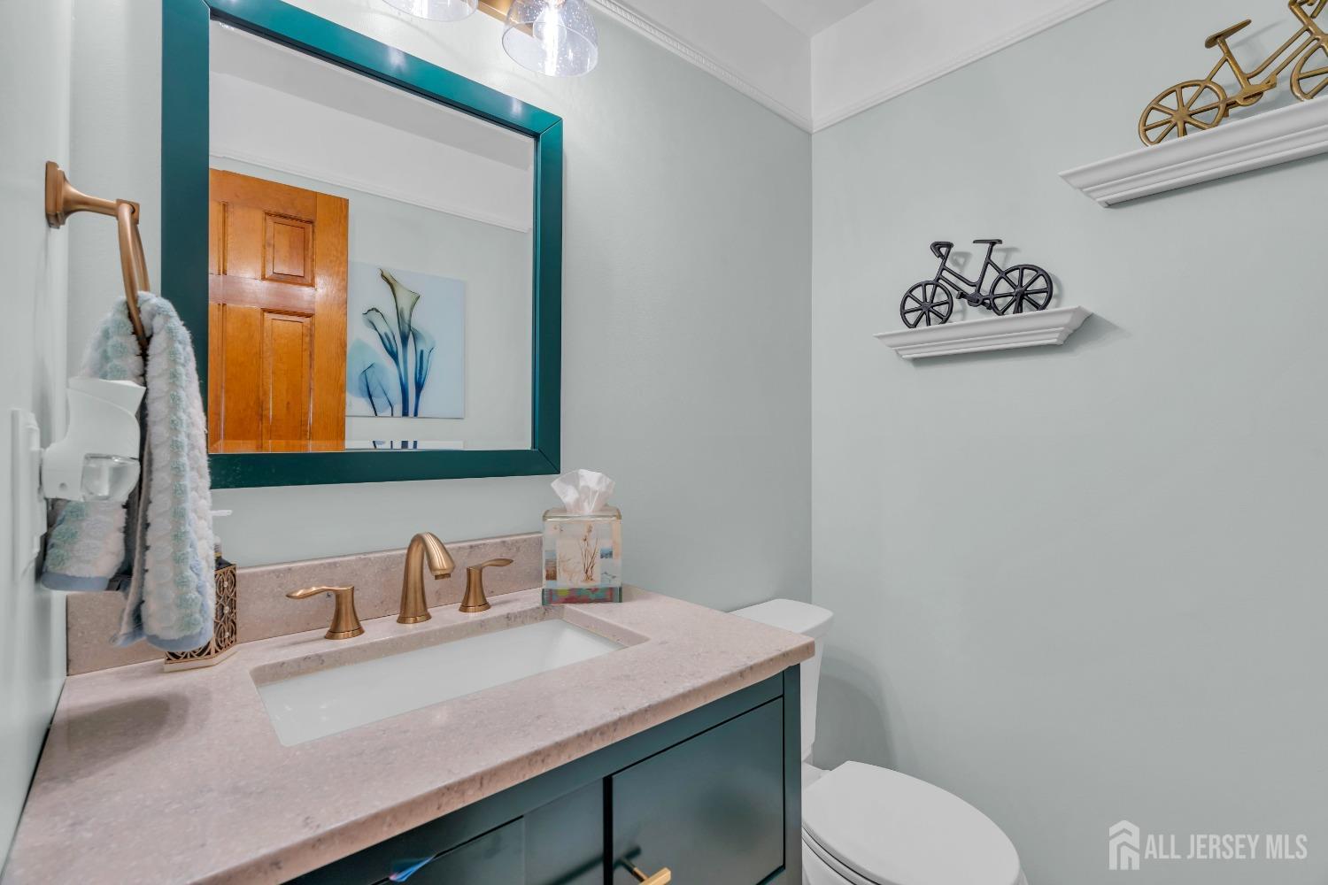 14 Daniel Place Old Bridge, NJ 07747 - Photo 15 of 38 a bathroom with a granite countertop toilet sink and mirror