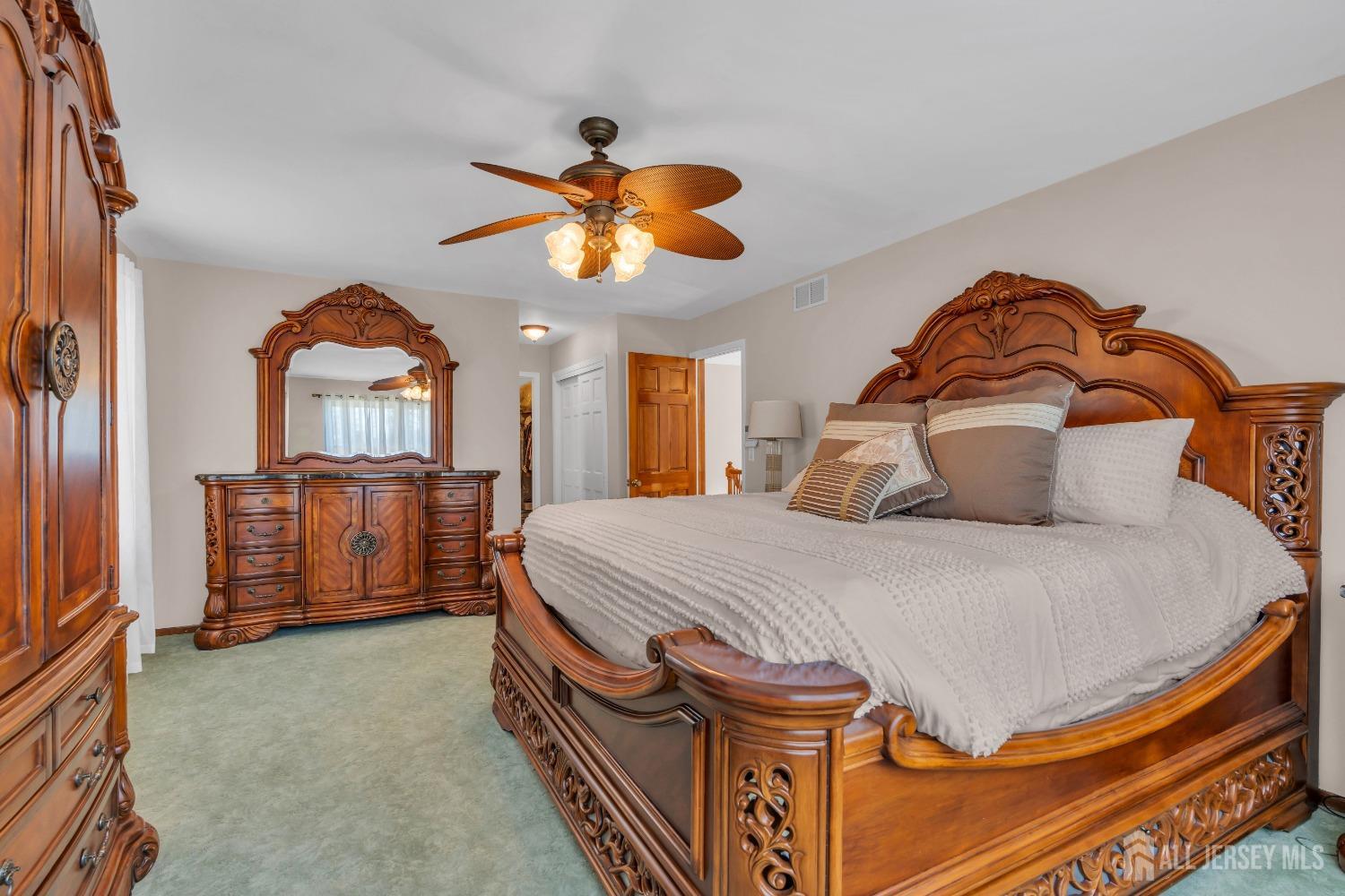 14 Daniel Place Old Bridge, NJ 07747 - Photo 17 of 38 a bedroom with a bed and a chandelier