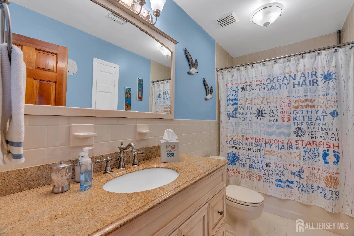 14 Daniel Place Old Bridge, NJ 07747 - Photo 22 of 38 a bathroom with a granite countertop sink mirror vanity and toilet