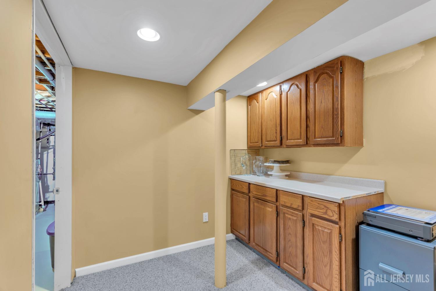 14 Daniel Place Old Bridge, NJ 07747 - Photo 26 of 38 a bathroom with a sink a mirror and a shower