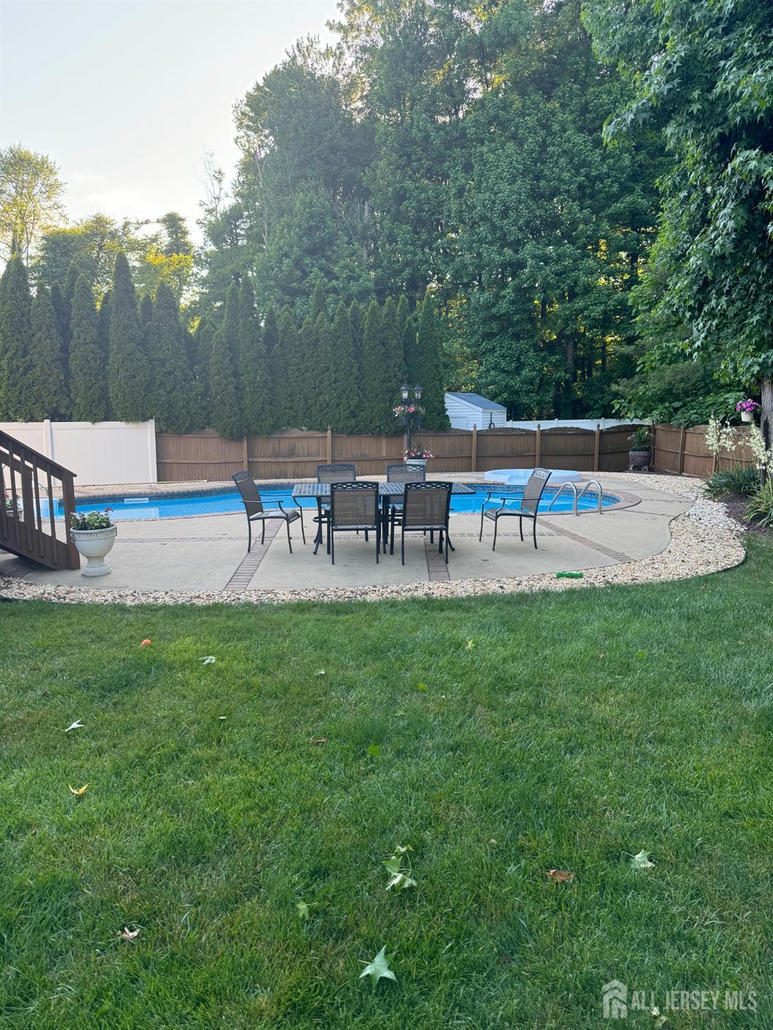 14 Daniel Place Old Bridge, NJ 07747 - Photo 34 of 38 a view of a table and chairs in the garden