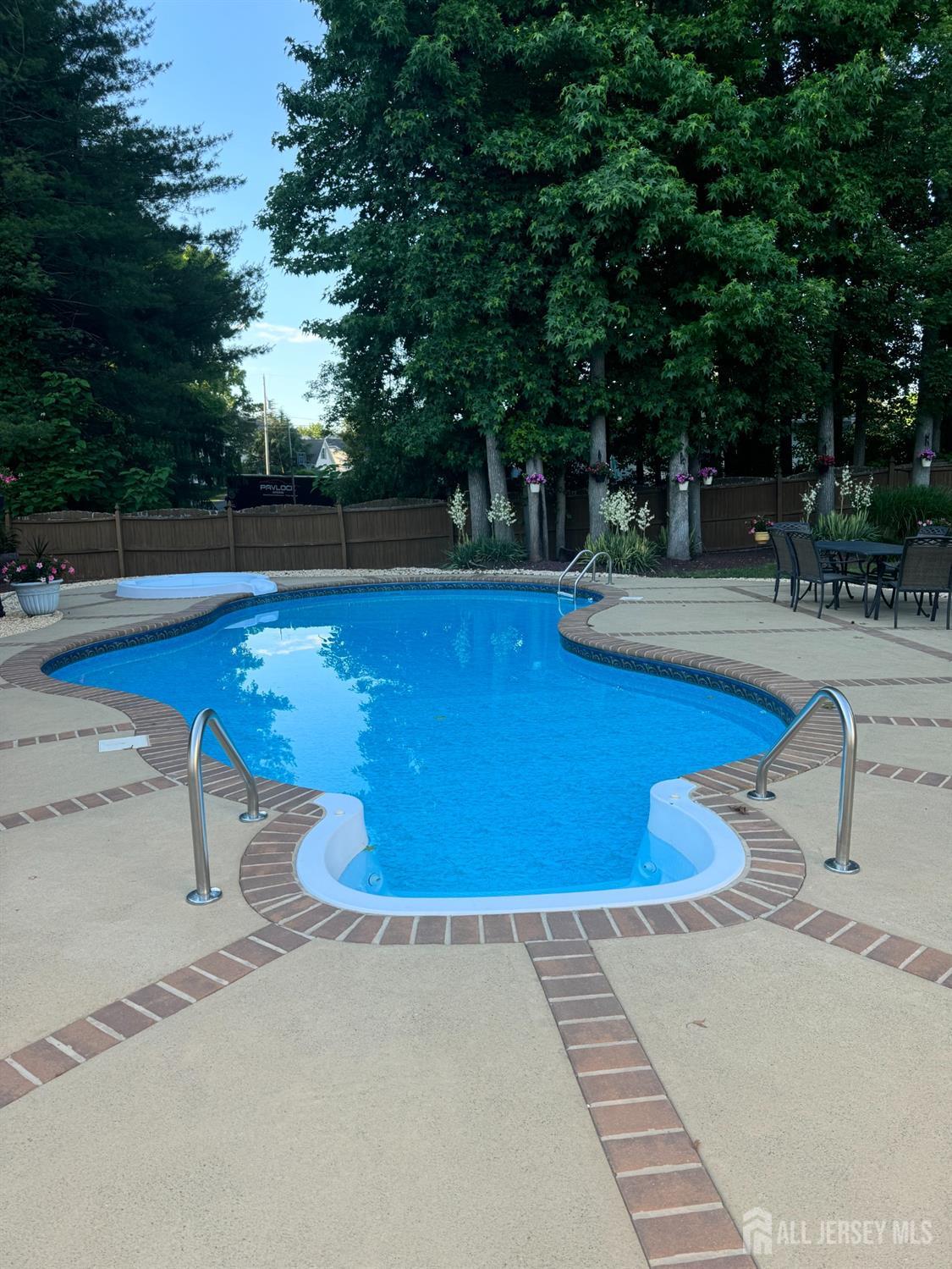 14 Daniel Place Old Bridge, NJ 07747 - Photo 35 of 38 a view of a swimming pool with an outdoor space and seating area