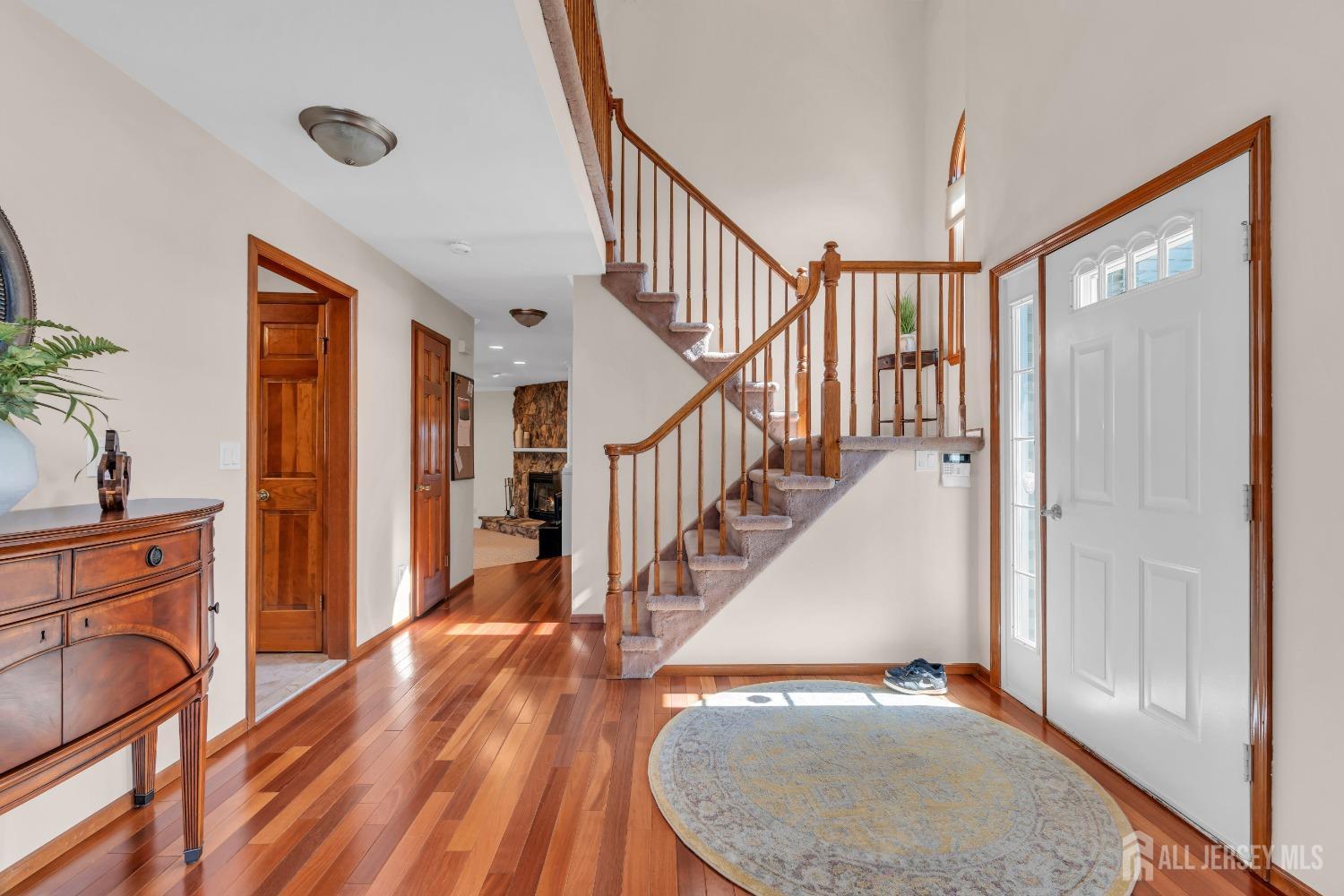 14 Daniel Place Old Bridge, NJ 07747 - Photo 8 of 38 a view of a livingroom with wooden floor and staircase