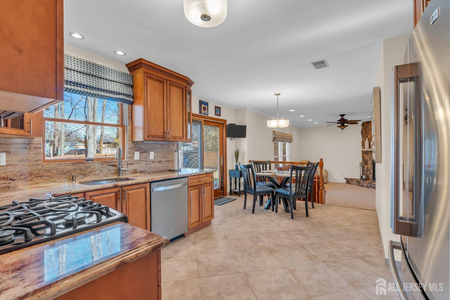 14 Daniel Place Old Bridge, NJ 07747 - Photo 10 of 38 a kitchen with a table and chairs
