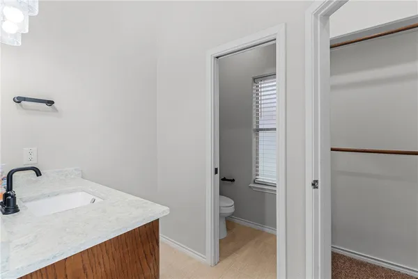 a bathroom with a sink and toilet
