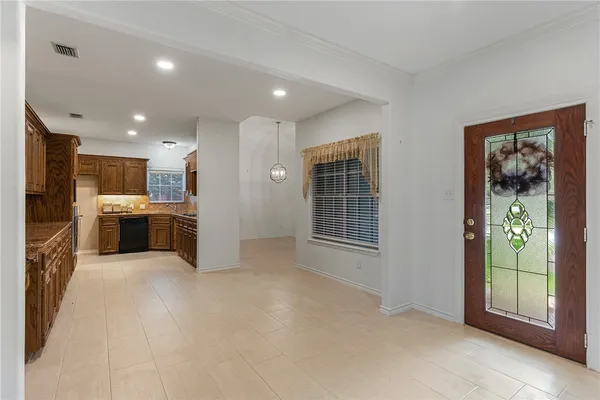 a view of a kitchen with furniture and a window
