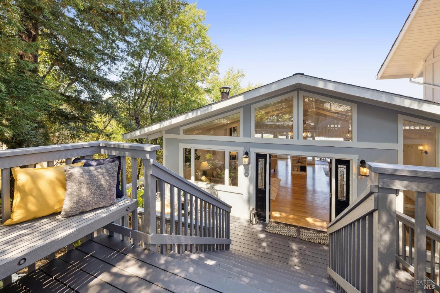 a front view of a house with wooden fence