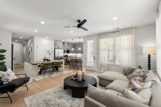 4770 Adairview Circle, Unit B Alpharetta, GA 30004 - Photo 4 of 7 a living room with furniture and a large window