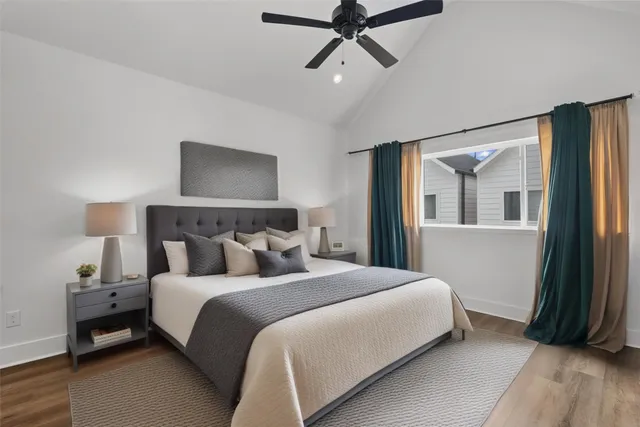 a bedroom with a bed and a painting