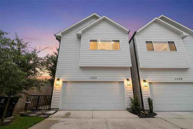 a front view of a house with garage