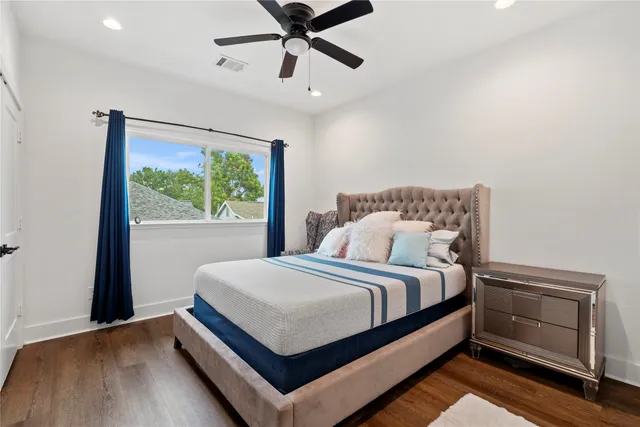 a bedroom with a bed and window