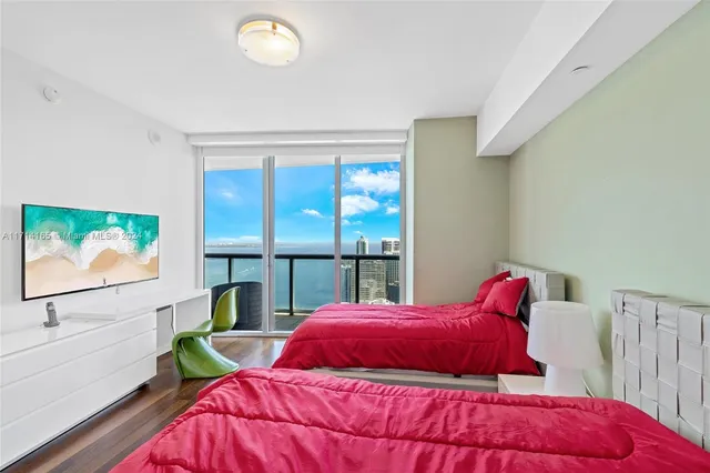 a bathroom with a double vanity sink toilet and a mirror