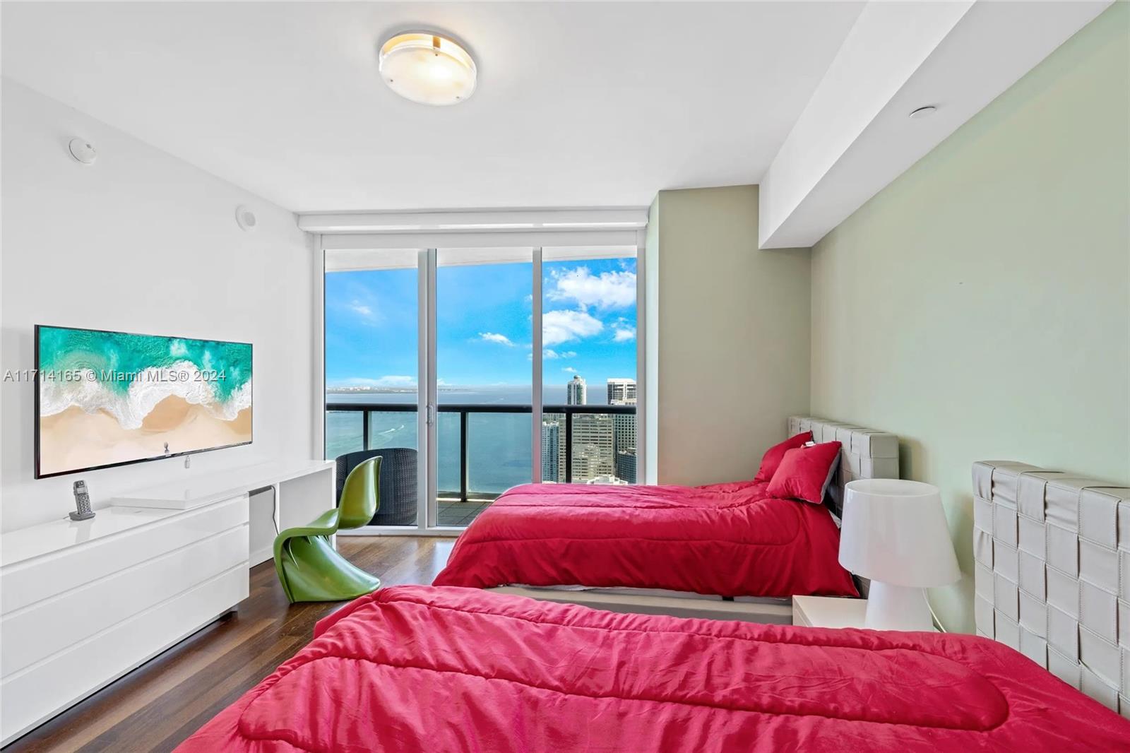 495 Brickell Avenue, Unit 4805 Miami, FL 33131 - Photo 13 of 20 a bedroom with a large bed and a window