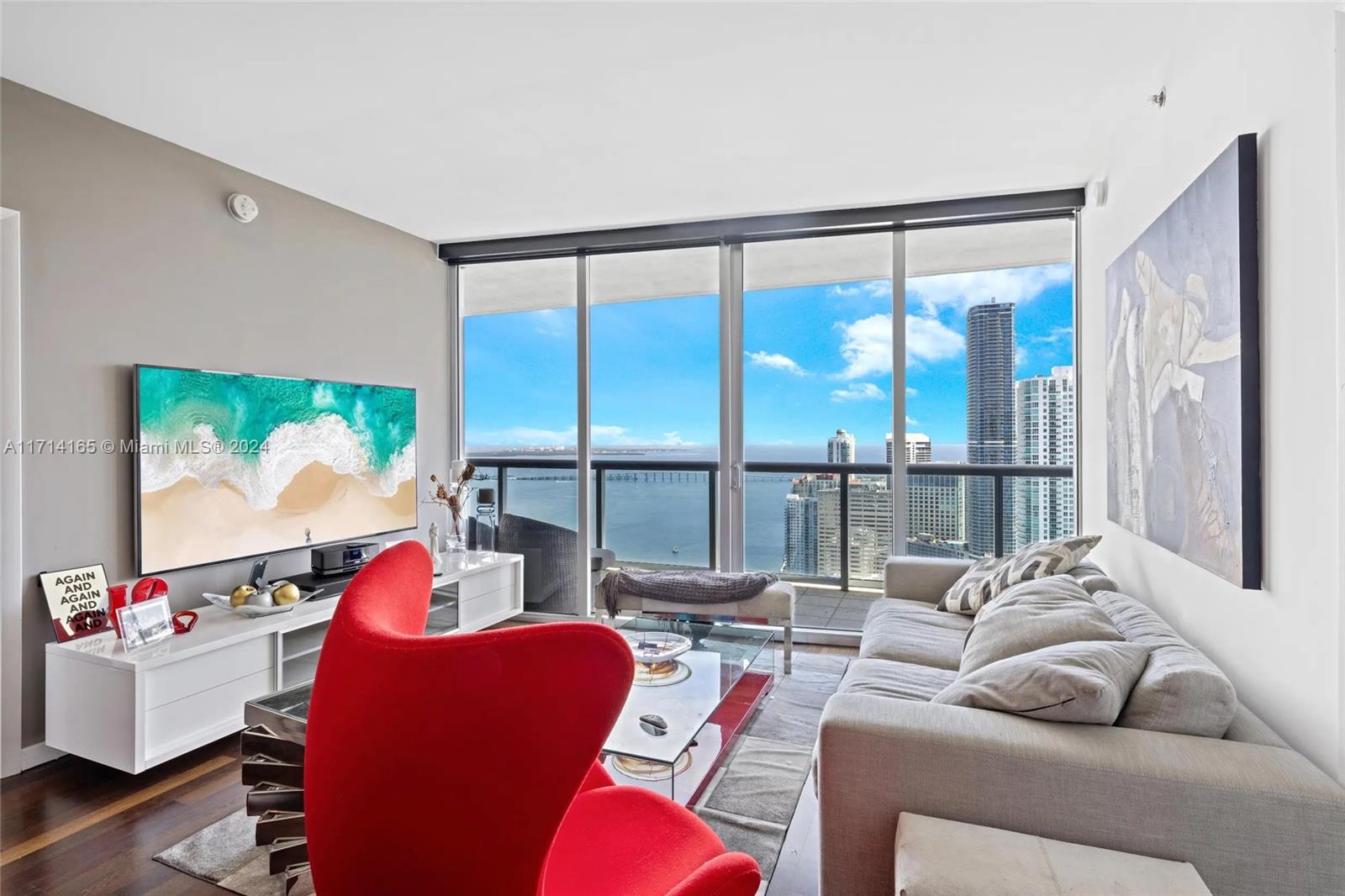 495 Brickell Avenue, Unit 4805 Miami, FL 33131 - Photo 7 of 20 a living room with furniture and a large window