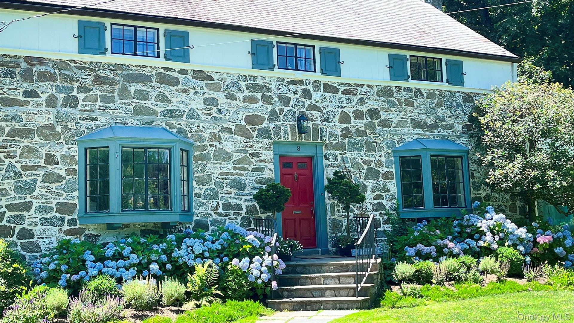 8 Holly Lane Rye, NY 10580 - Photo 2 of 27 View of front of home featuring stone siding