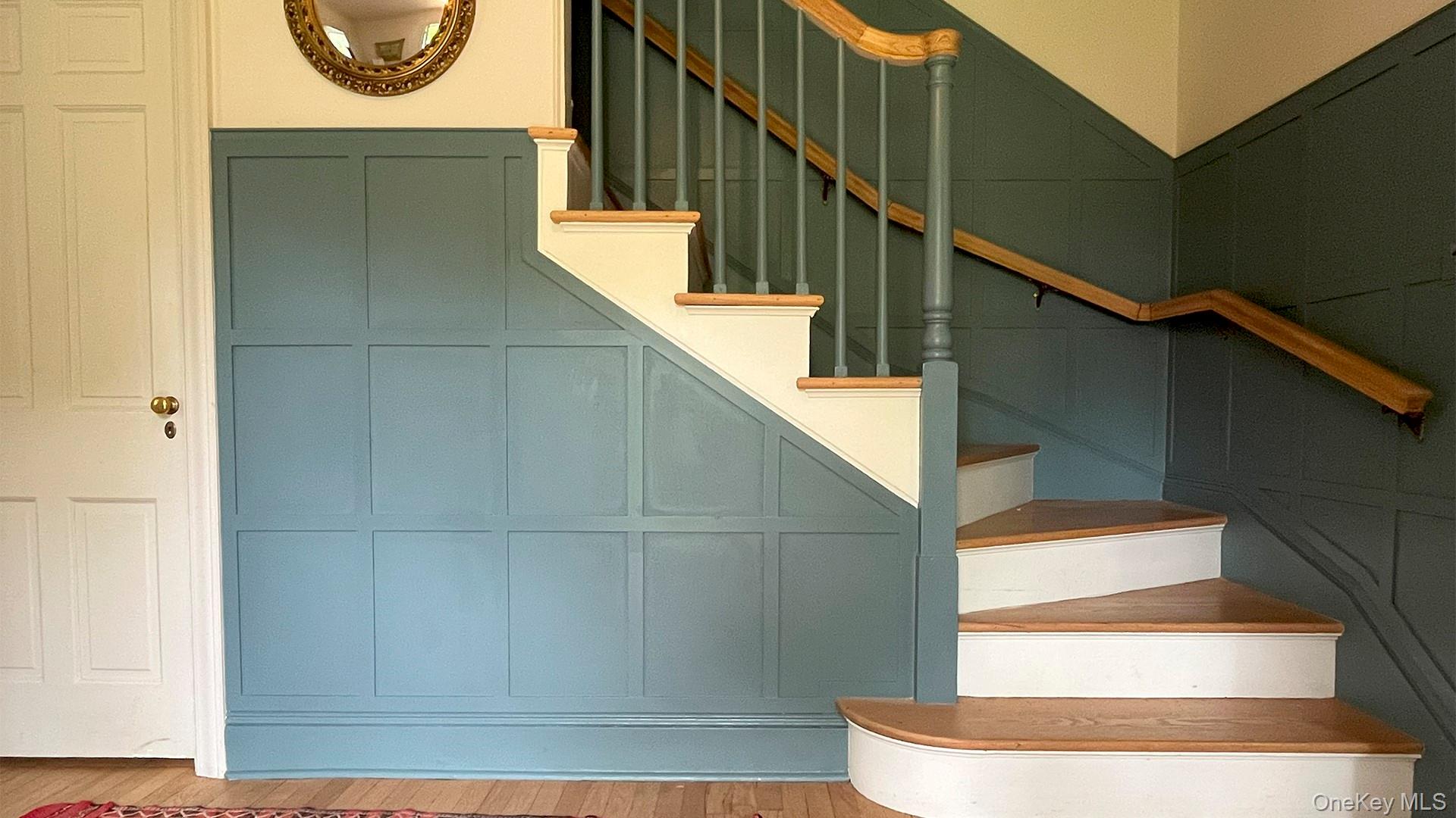 8 Holly Lane Rye, NY 10580 - Photo 6 of 27 Stairs featuring a decorative wall and wood finished floors