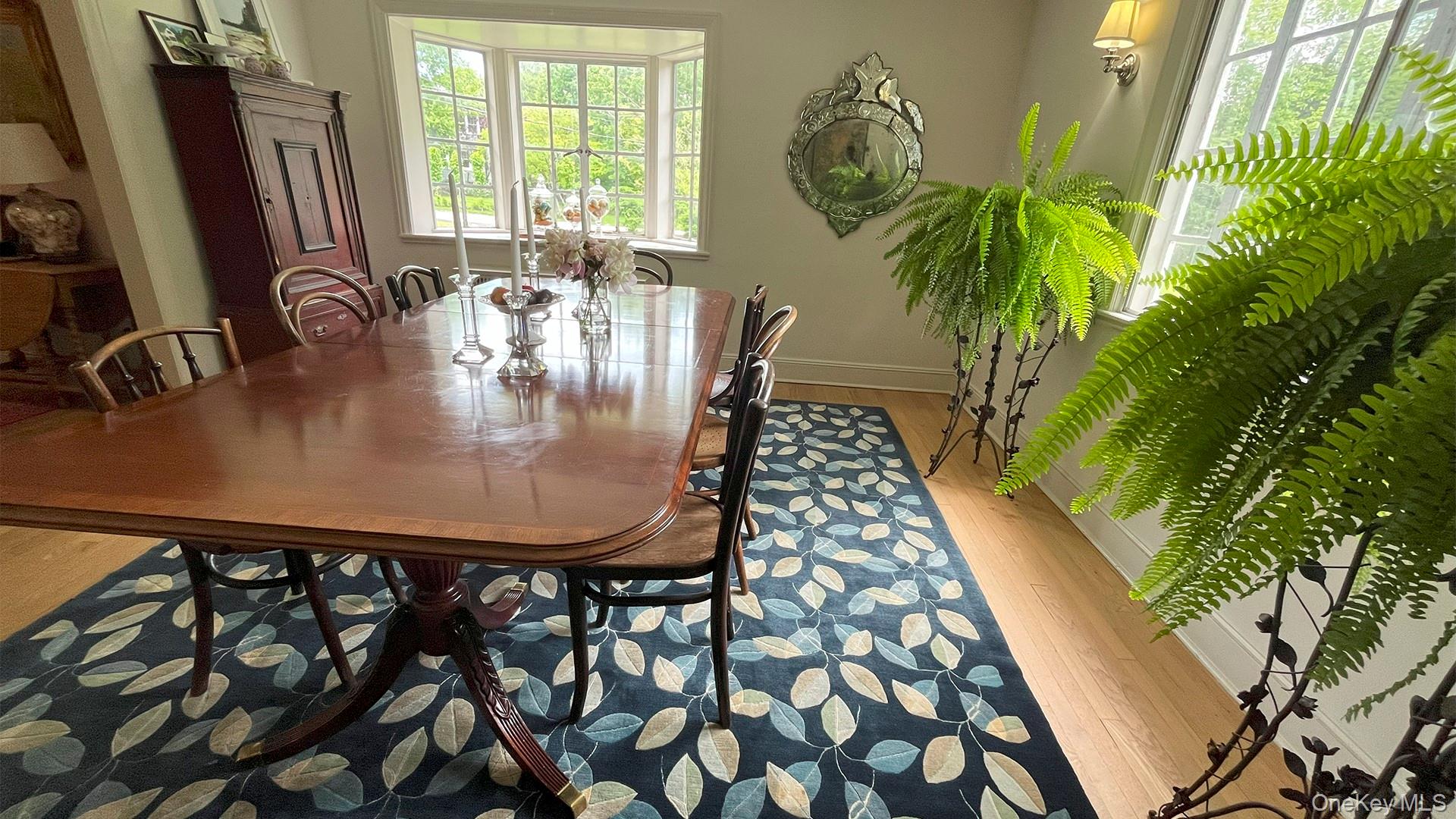 8 Holly Lane Rye, NY 10580 - Photo 8 of 27 Dining room with ample natural light and gleaming hardwood floors