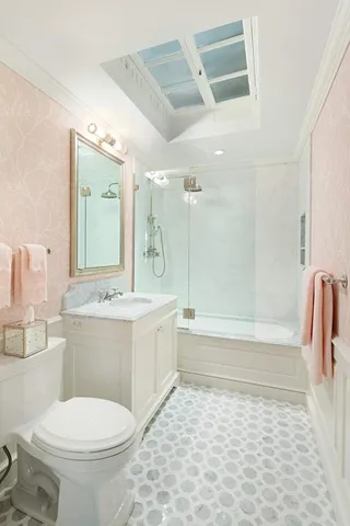 a bathroom with a sink a toilet and a bathtub