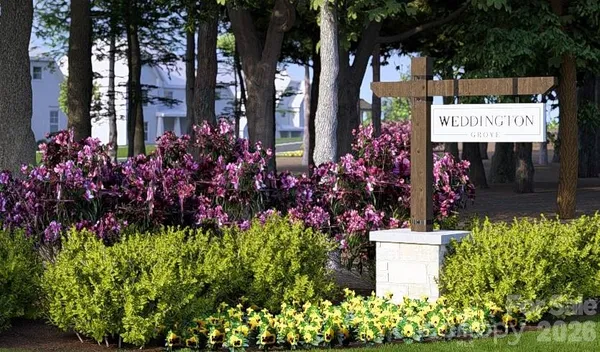 a sign that is in front of flowers