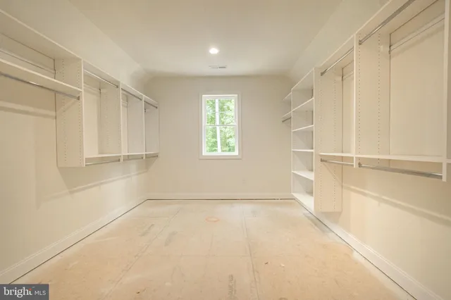 a bathroom with a sink a toilet and a window