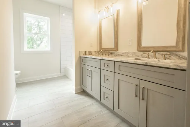 a kitchen with granite countertop a sink cabinets and granite countertops