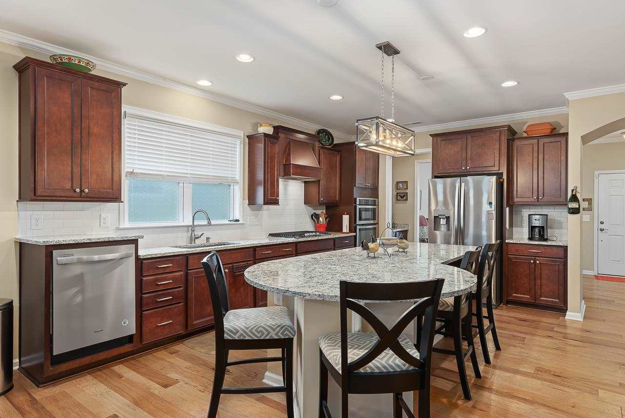 613 Tuttle Road Durham, NC 27703 - Photo 9 of 30 Large countertops offers additional seating. Notice the raised dishwasher that makes for easy loading. No more stopping down to reach the back! Kitchen