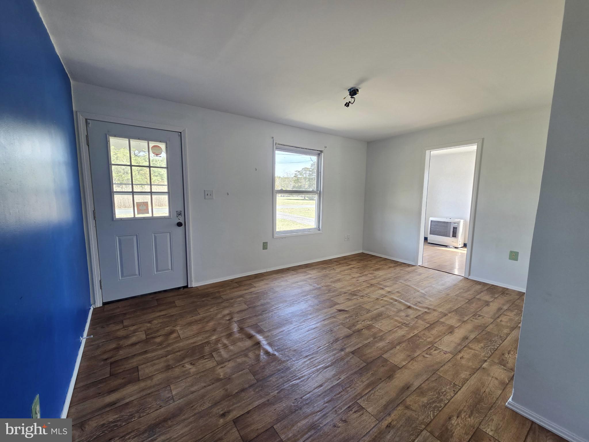 2539 Toddville Road Toddville, MD 21672 - Photo 17 of 31 a view of an empty room with window and wooden floor
