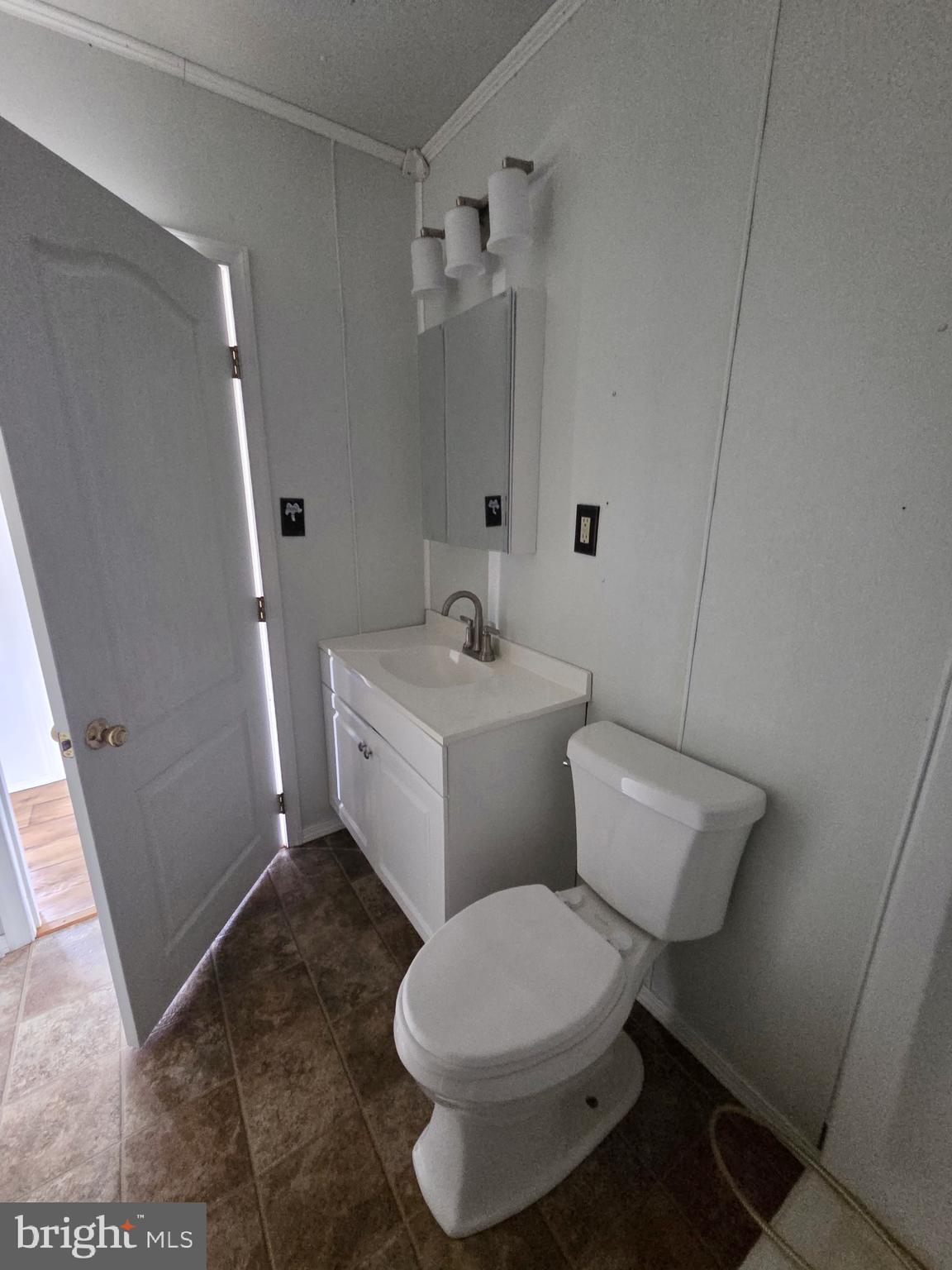 2539 Toddville Road Toddville, MD 21672 - Photo 20 of 31 a white toilet sitting next to a bathroom sink