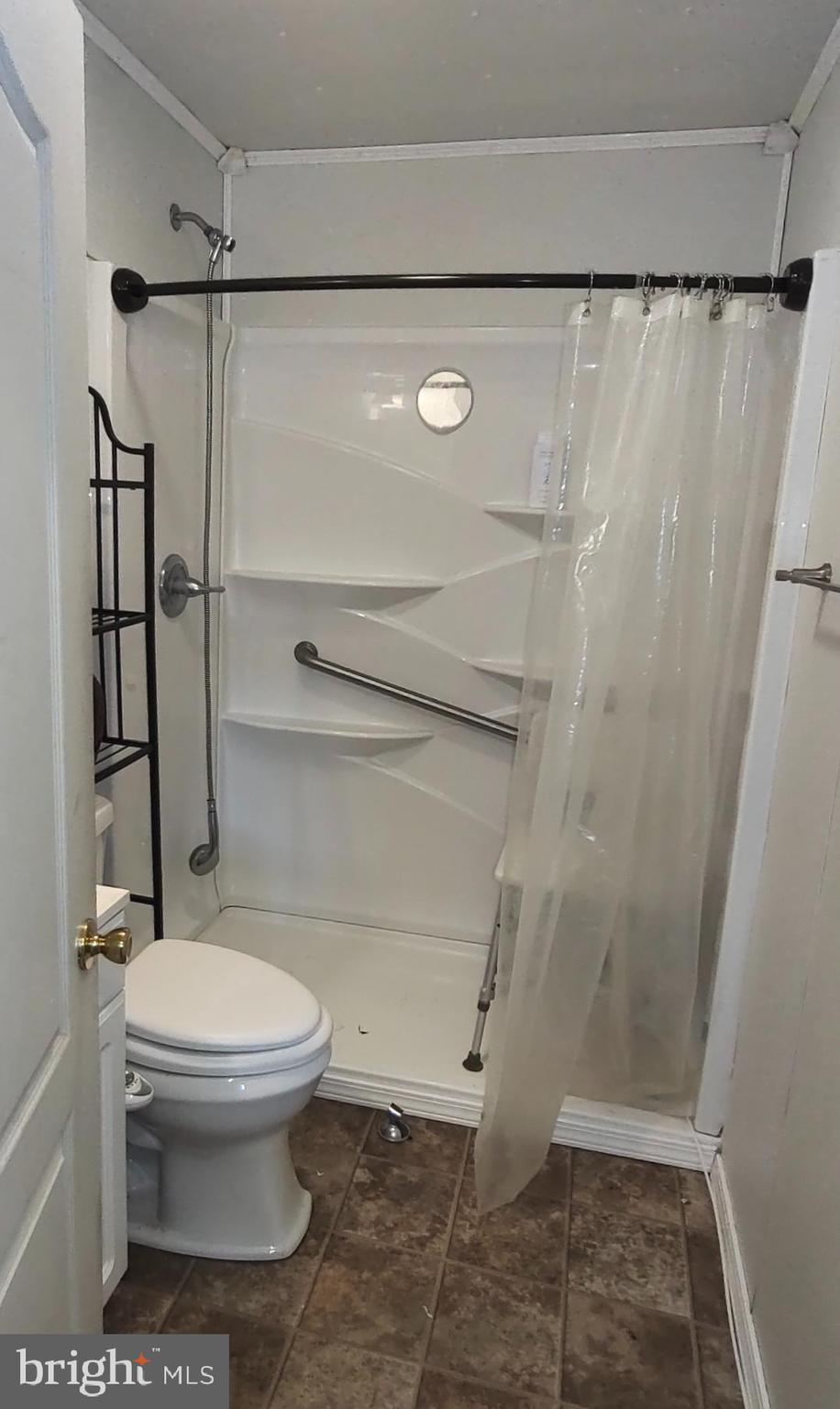 2539 Toddville Road Toddville, MD 21672 - Photo 21 of 31 a bathroom with a toilet and a shower