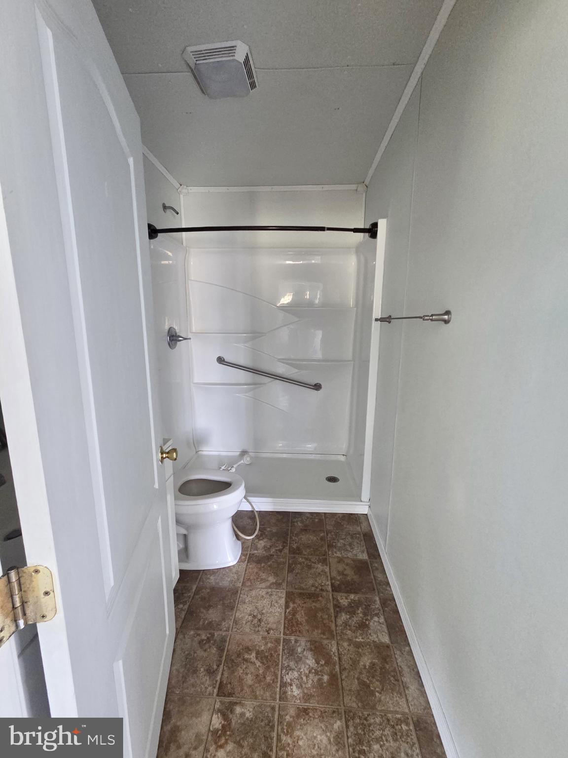 2539 Toddville Road Toddville, MD 21672 - Photo 25 of 31 a bathroom with a toilet and a shower