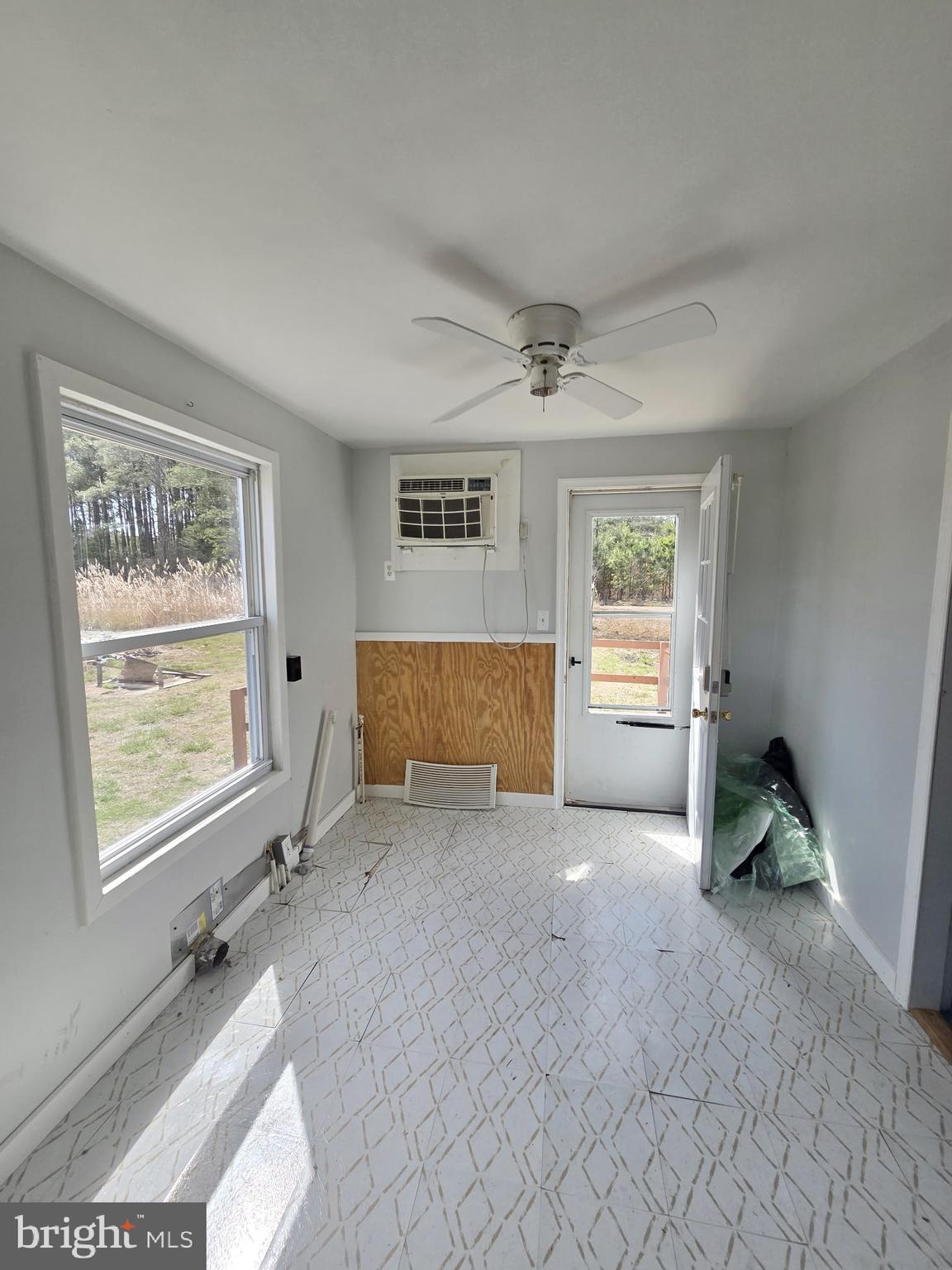 2539 Toddville Road Toddville, MD 21672 - Photo 27 of 31 a view of an empty room with a window and wooden floor