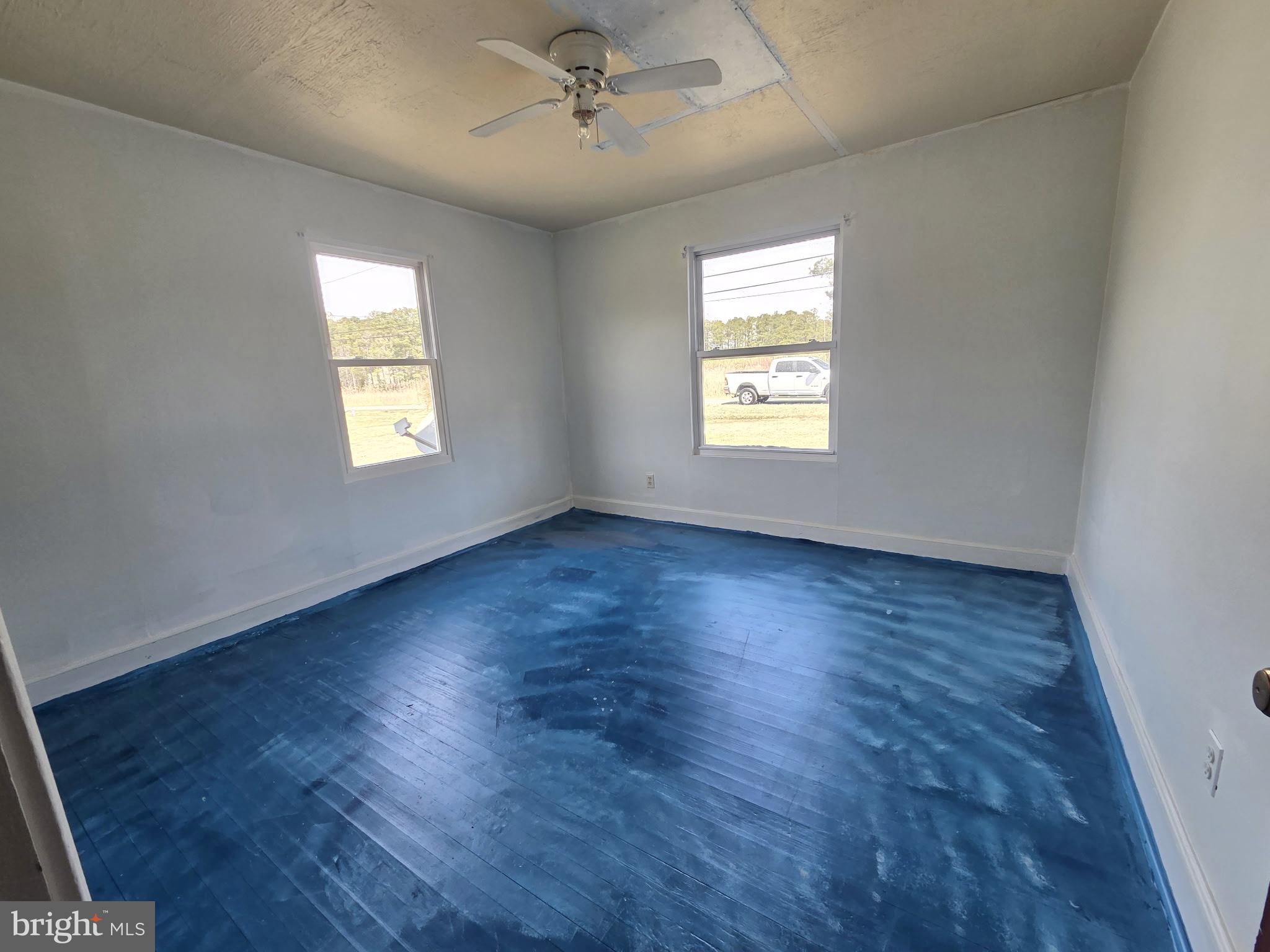 2539 Toddville Road Toddville, MD 21672 - Photo 29 of 31 a view of an empty room with wooden floor and a window