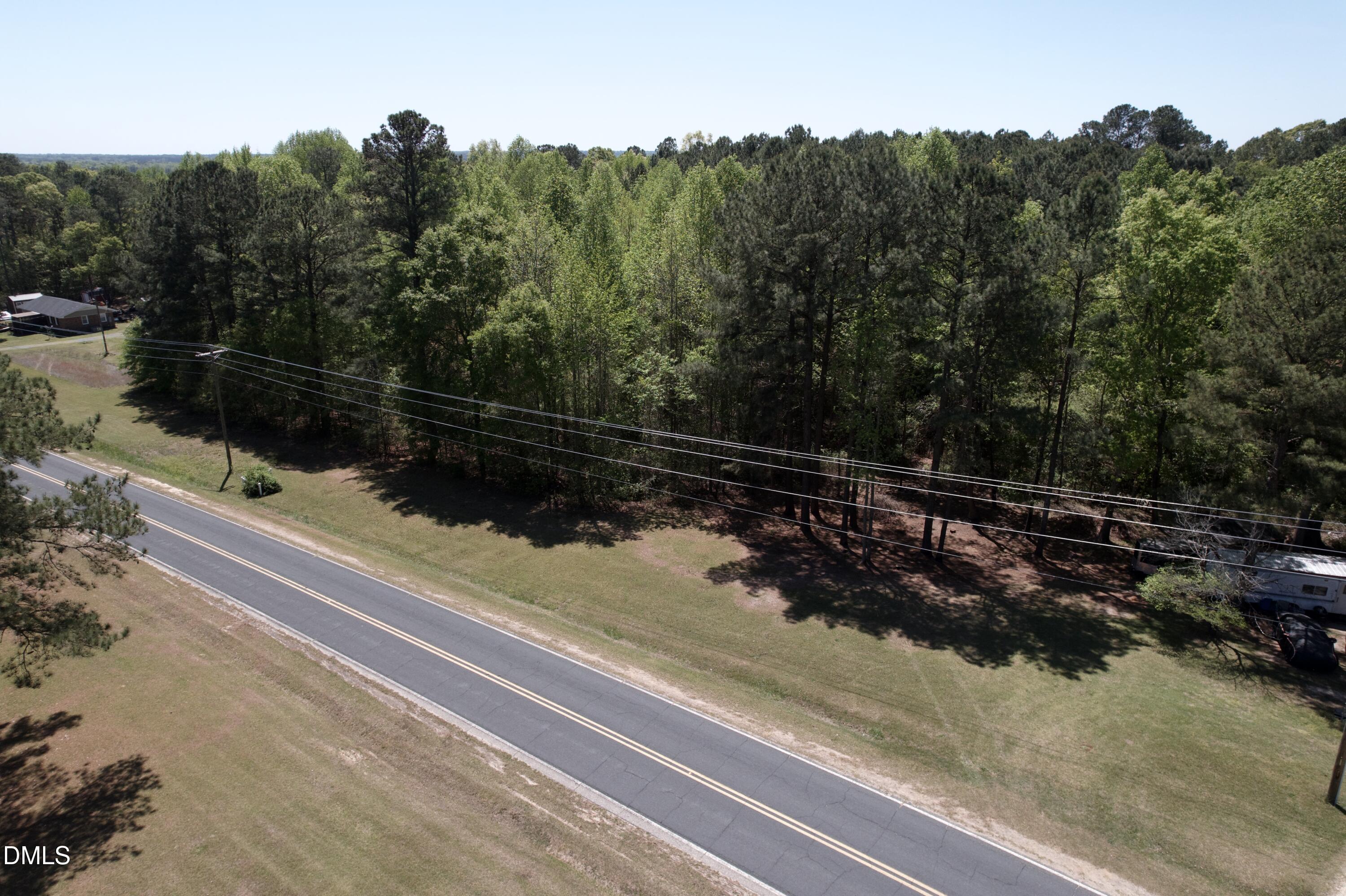 Na Joel Johnson Road Lillington, NC 27546 - Photo 12 of 15 a view of a street with a wooden bench