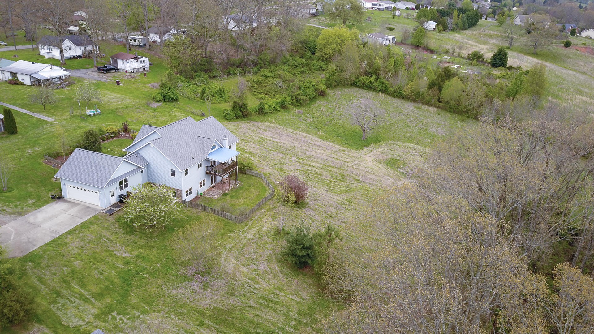 3941 Big Springs Ridge Road Friendsville, TN 37737 - Photo 6 of 38 an aerial view of a house with a yard