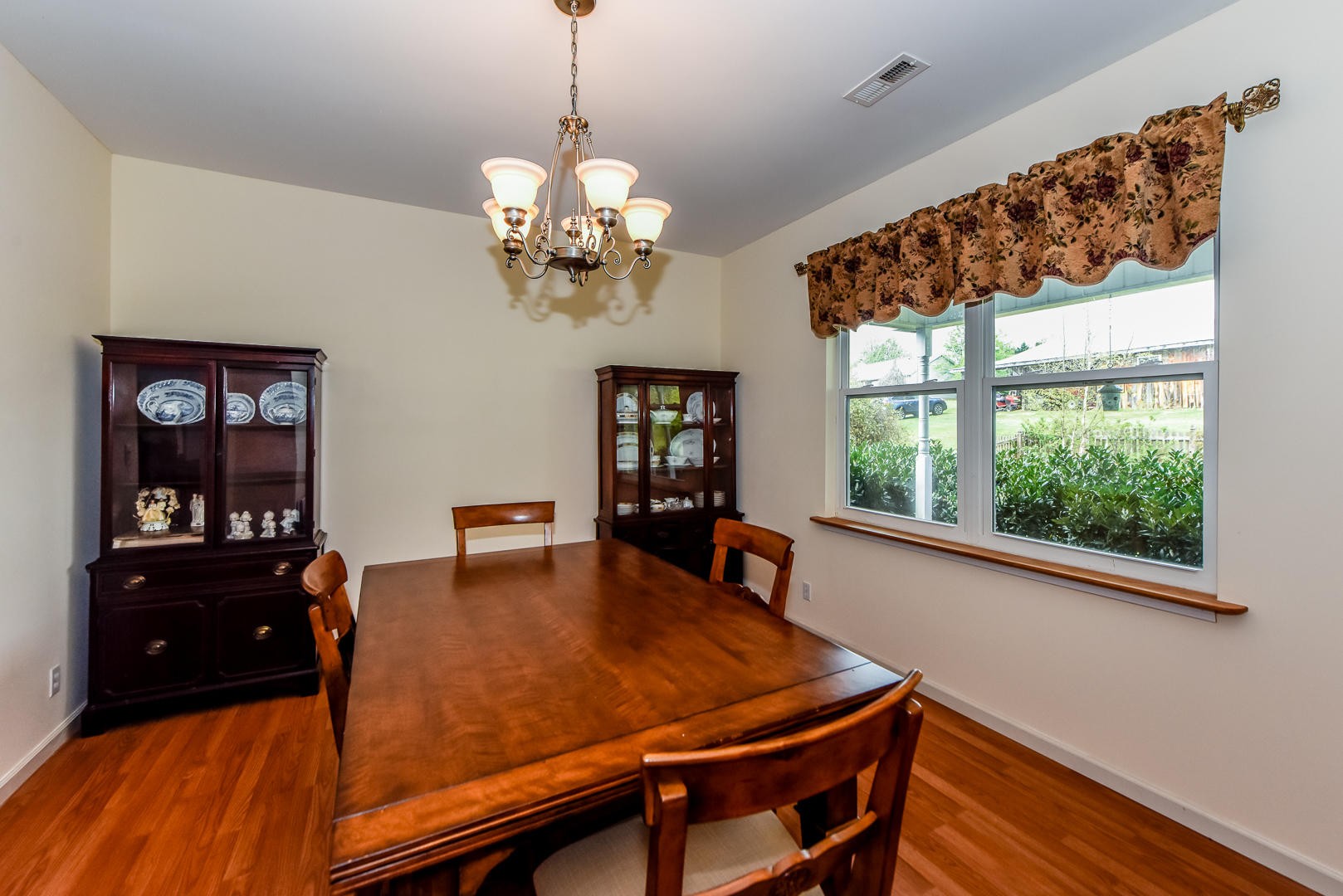 3941 Big Springs Ridge Road Friendsville, TN 37737 - Photo 9 of 38 a view of a dining room with furniture window and wooden floor