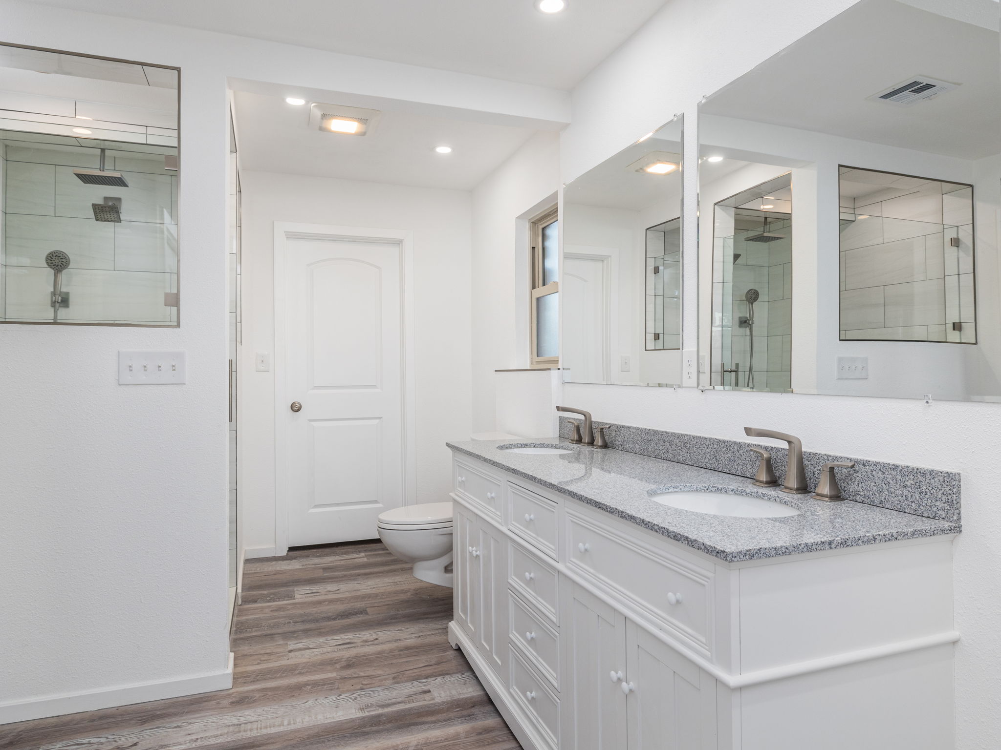 806 Country Club Road Georgetown, TX 78628 - Photo 24 of 39 Fully remodeled en suite on the first primary features a double vanity walk in shower and two closets