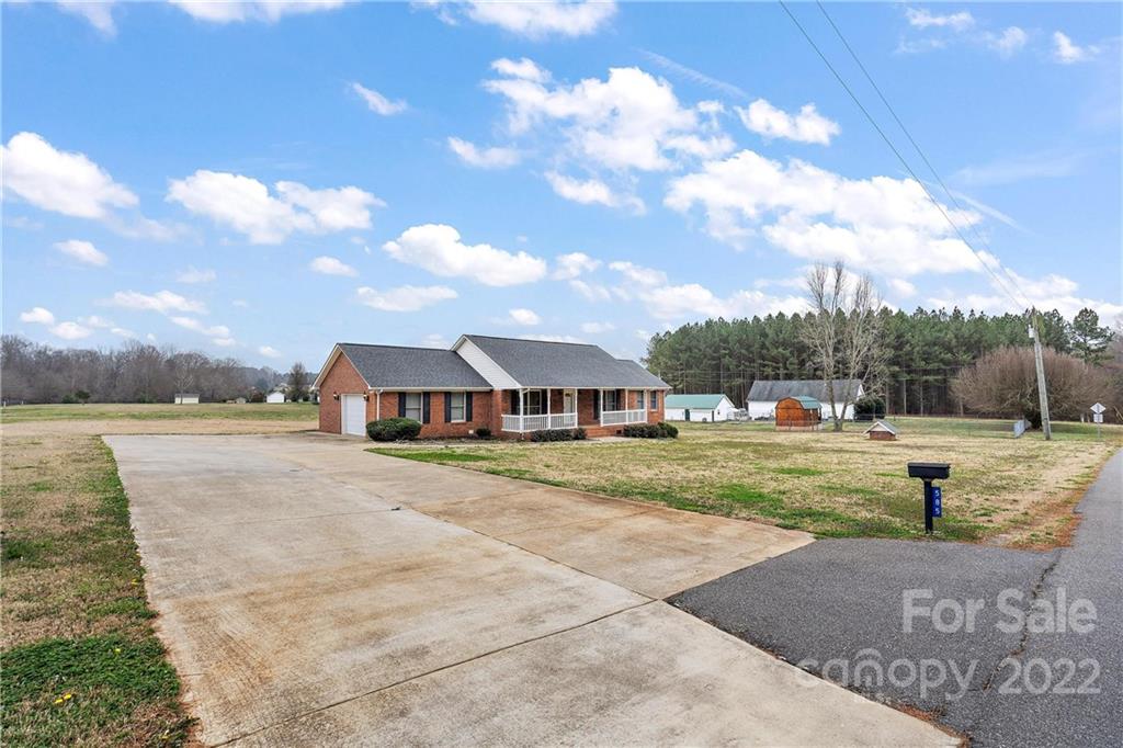 585 Windy Hill Road York, SC 29745 - Photo 3 of 38 a view of a house with a big yard