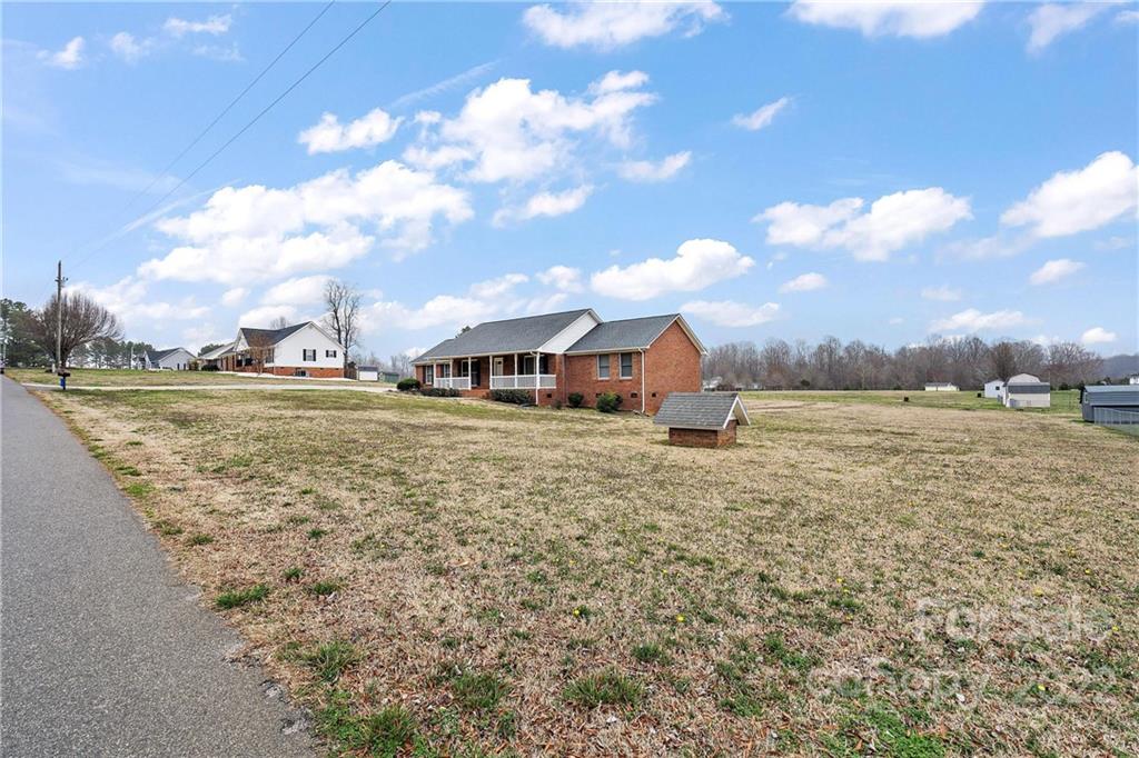 585 Windy Hill Road York, SC 29745 - Photo 5 of 38 a view of a lake with houses