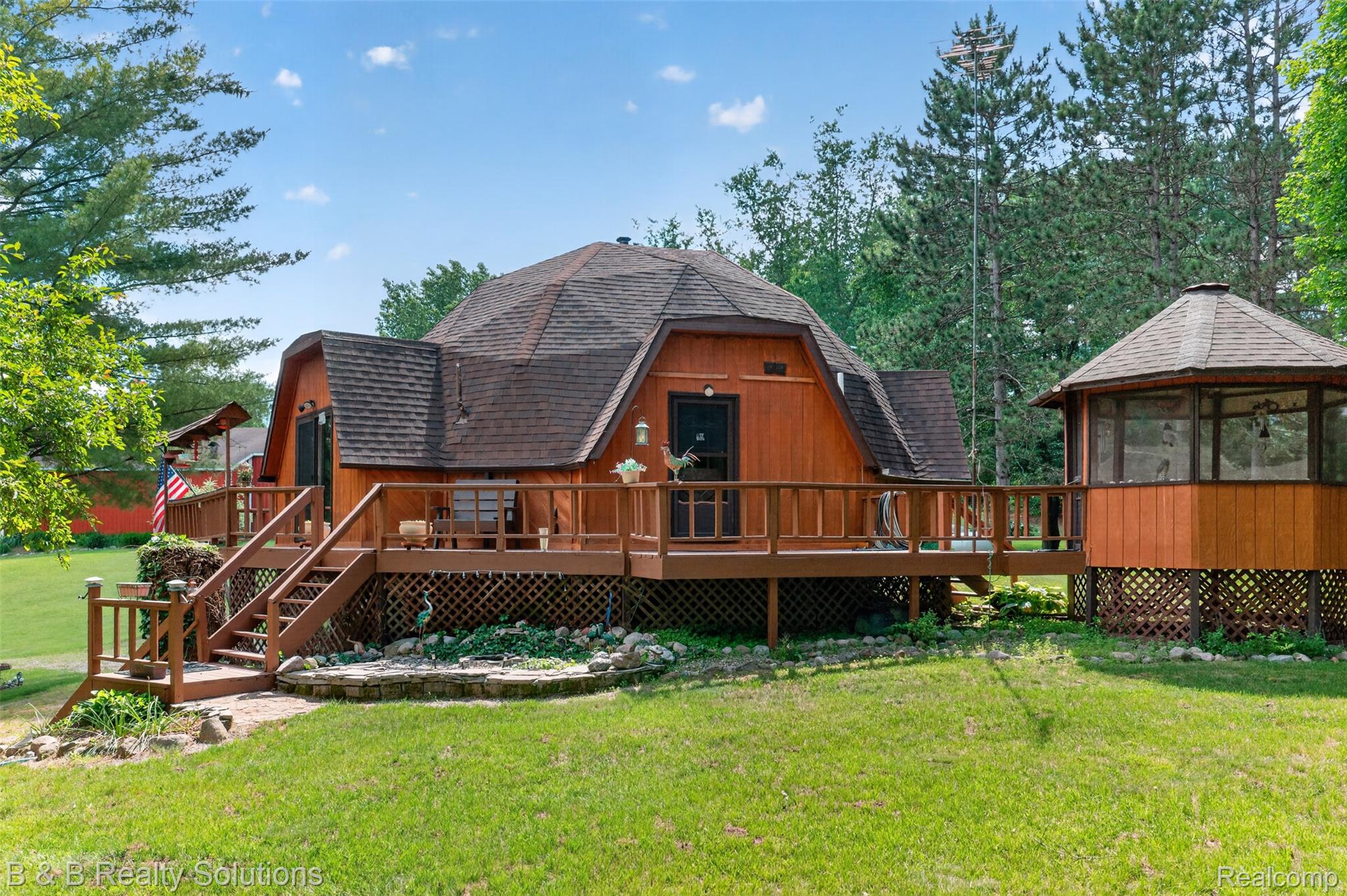 5544 Piersonville Road Columbiaville, MI 48421 - Photo 6 of 49 Unique dome-style residence with wood-finish siding, a multi-tiered deck, and a detached screened gazebo