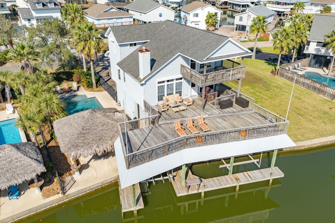 1319 Coral Way Tiki Island, TX 77554 - Photo 1 of 45 a view of a house with pool