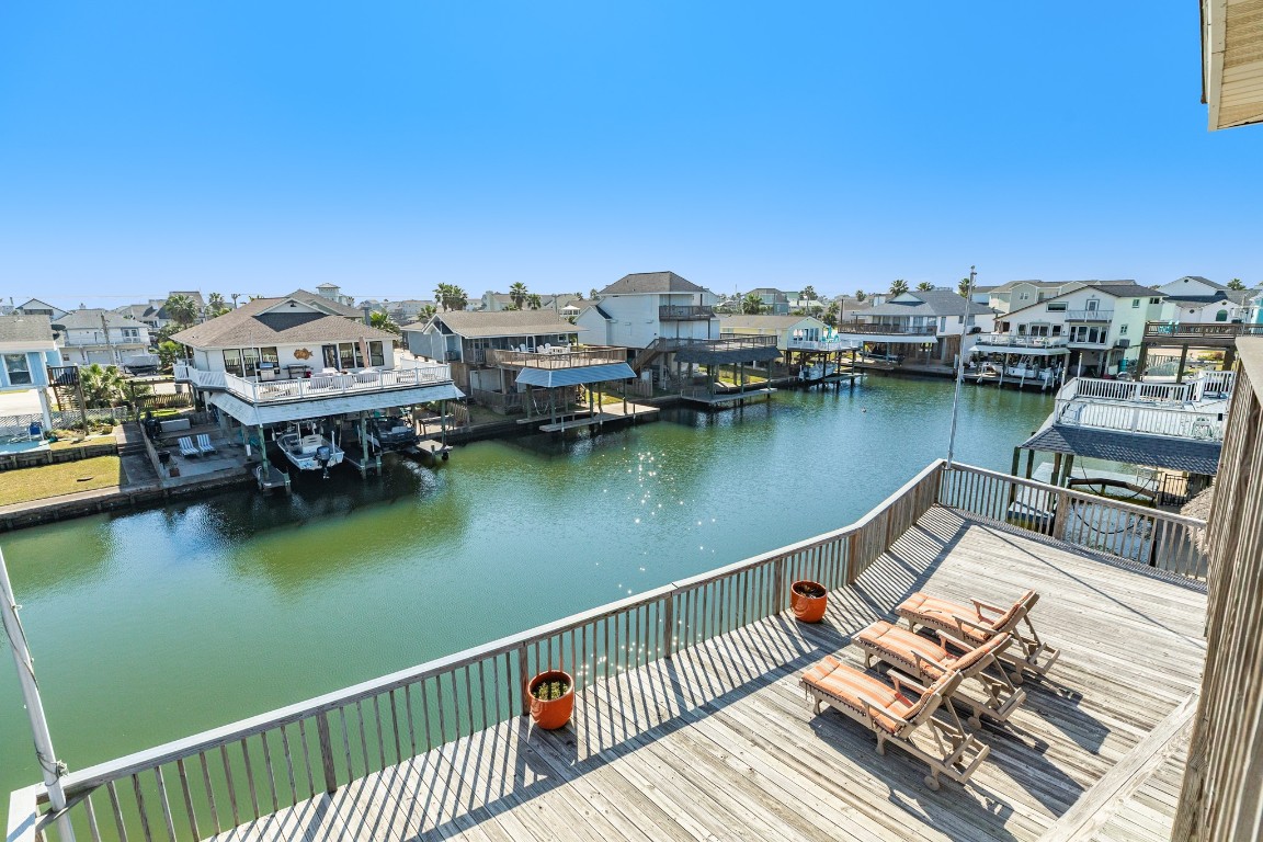 1319 Coral Way Tiki Island, TX 77554 - Photo 16 of 45 a view of a lake with houses