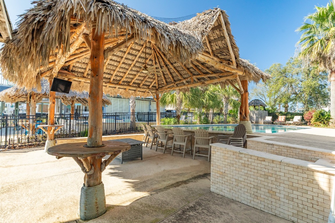 1319 Coral Way Tiki Island, TX 77554 - Photo 20 of 45 a view of fountain with a bench in front of building