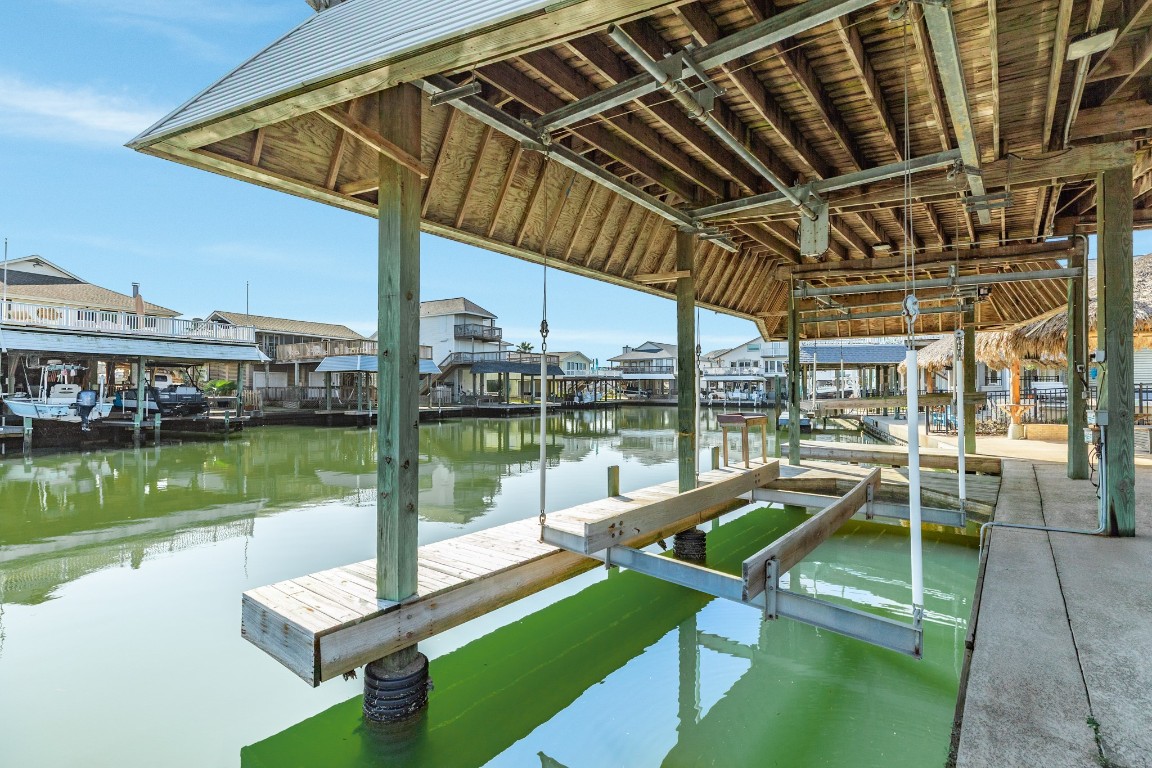 1319 Coral Way Tiki Island, TX 77554 - Photo 24 of 45 a view of a swimming pool with a patio