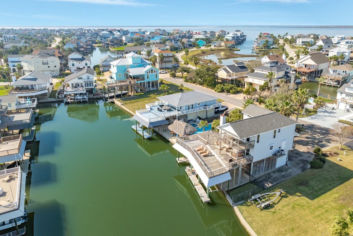 1319 Coral Way Tiki Island, TX 77554 - Photo 5 of 45 an aerial view of residential houses with outdoor space
