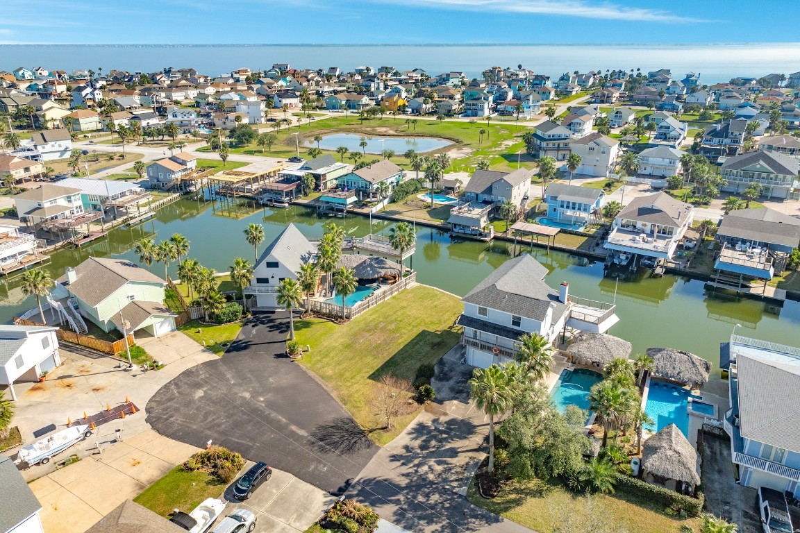 1319 Coral Way Tiki Island, TX 77554 - Photo 9 of 45 an aerial view of residential houses with outdoor space