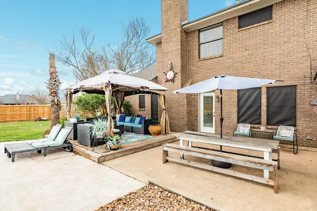 a view of a lounge chairs in the patio