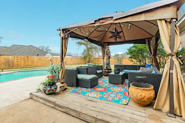 a view of a swimming pool with a patio