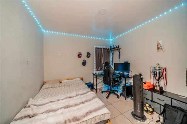 a bedroom with a bed and a desk