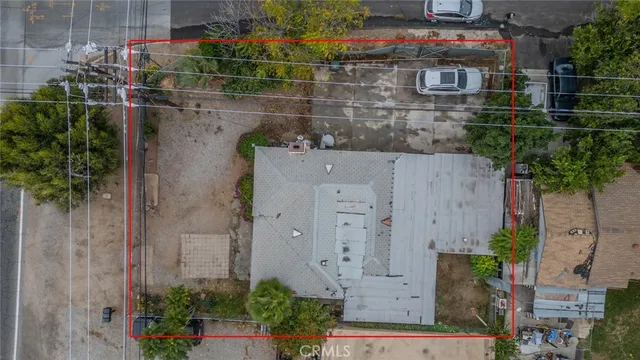 an aerial view of house with yard