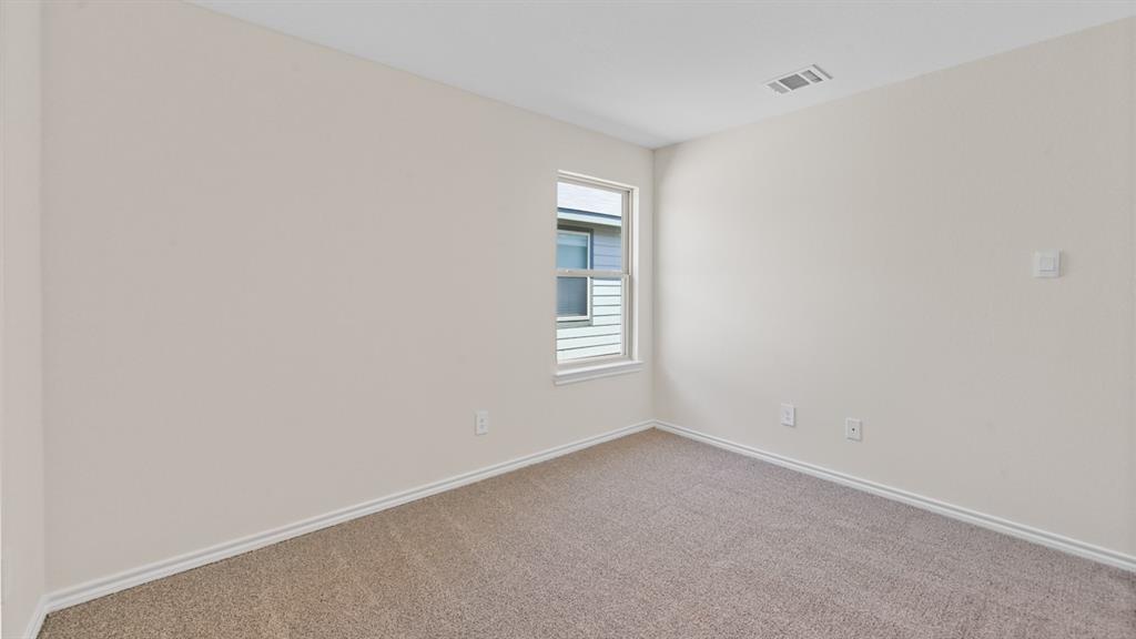 657 Glee Stem Road Lavon, TX 75166 - Photo 21 of 26 Carpeted room featuring a single window with white trim, light beige wall paint, white baseboards, and a ceiling vent